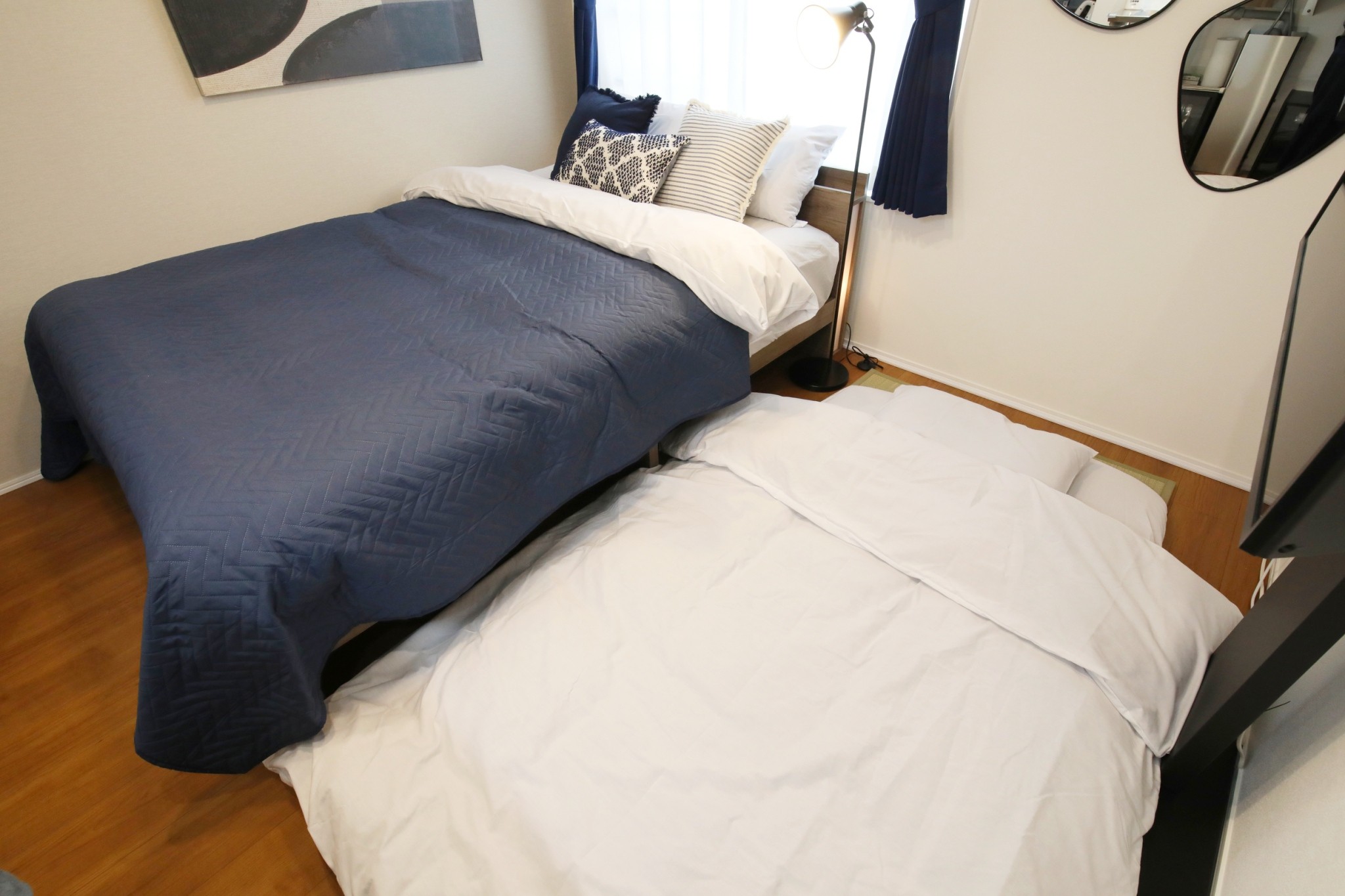 Room 202 double bed and extra futon sleep configuration