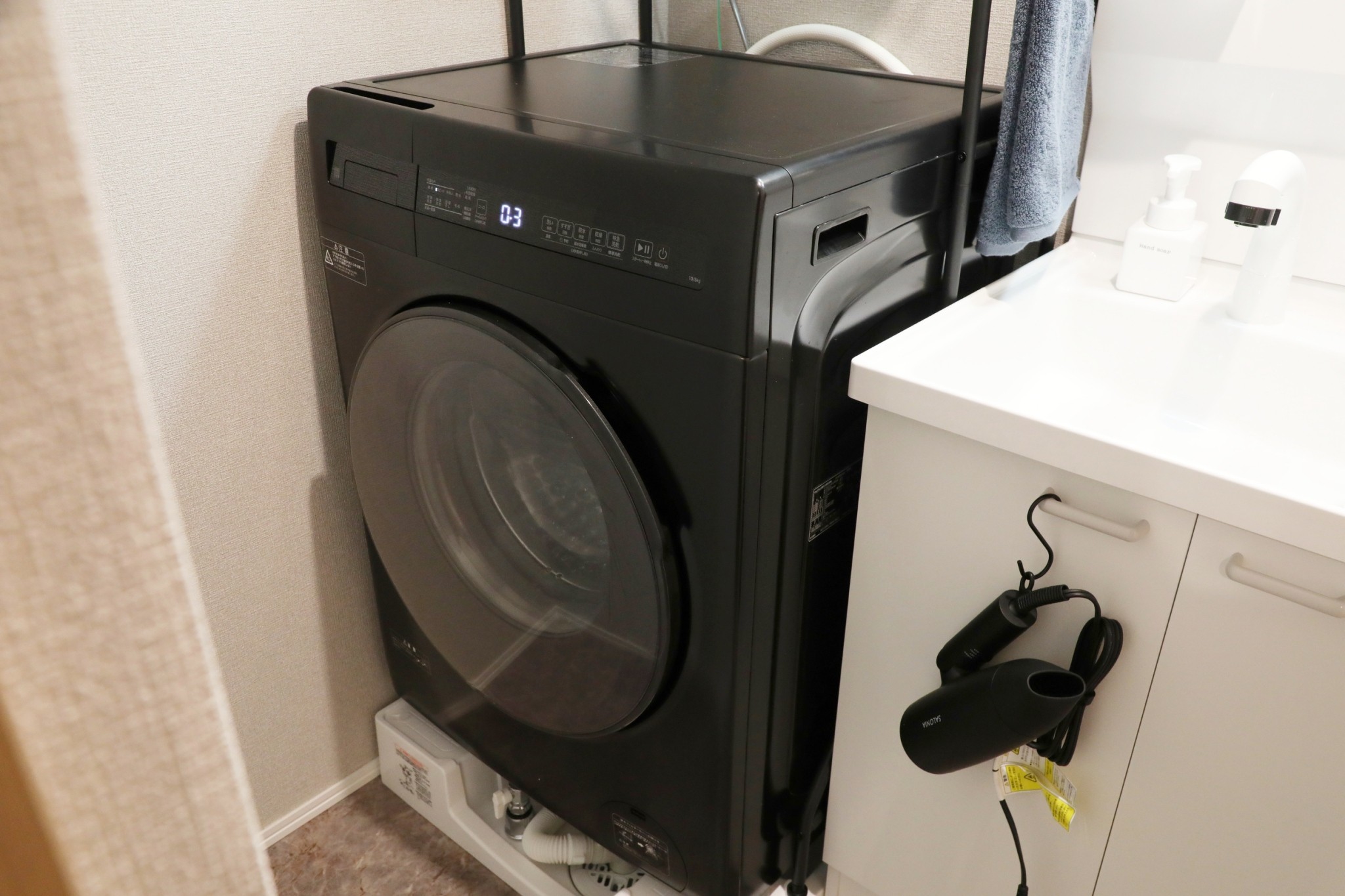 Room 202 drum washing machine and vanity