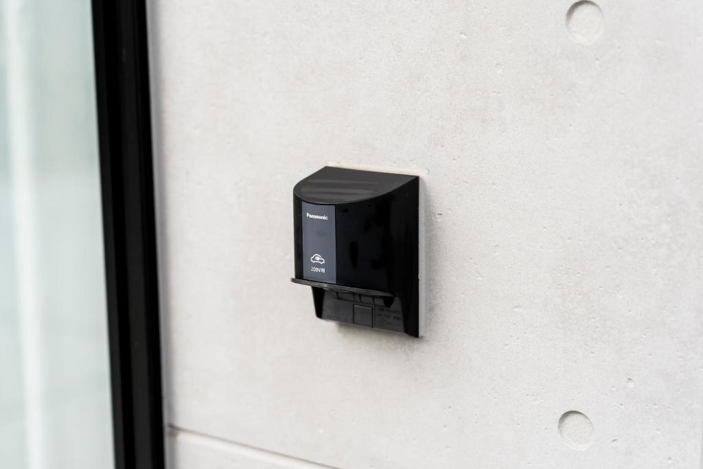 Panasonic 200V EV charger in parking area