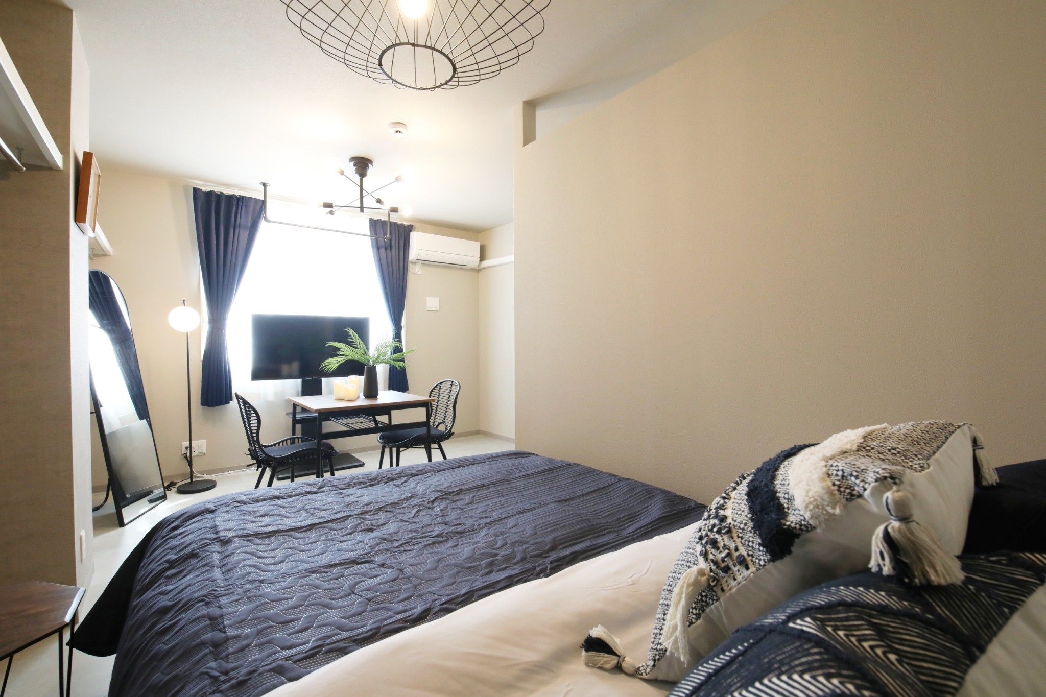 Room 101 wide angle showing bed and dining zone