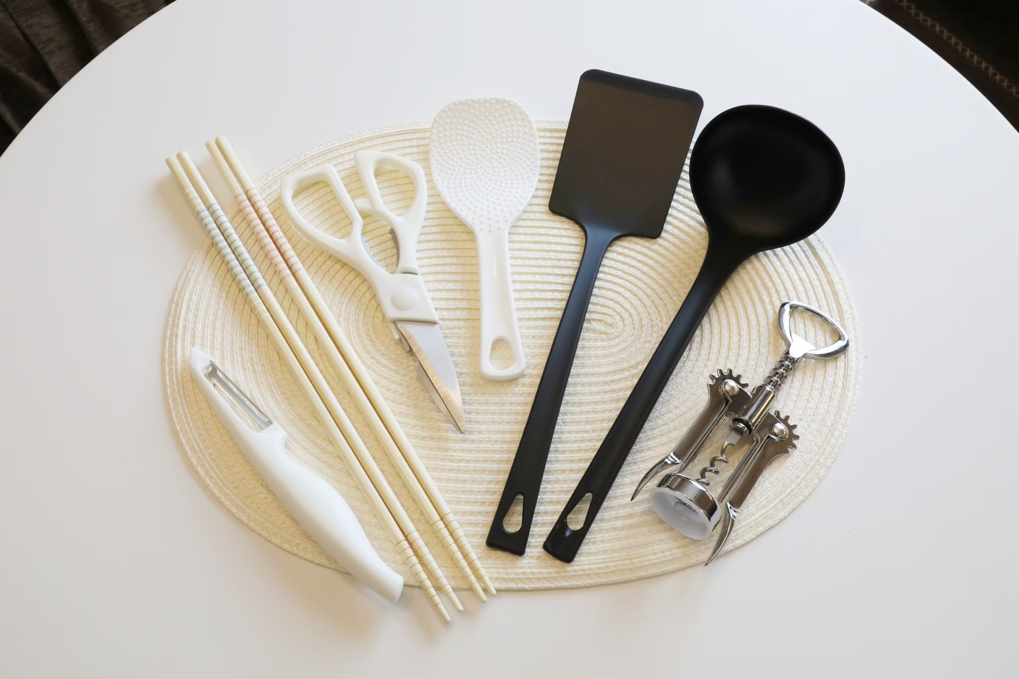 Room 103 kitchen utensils — chopsticks, spatulas, corkscrew